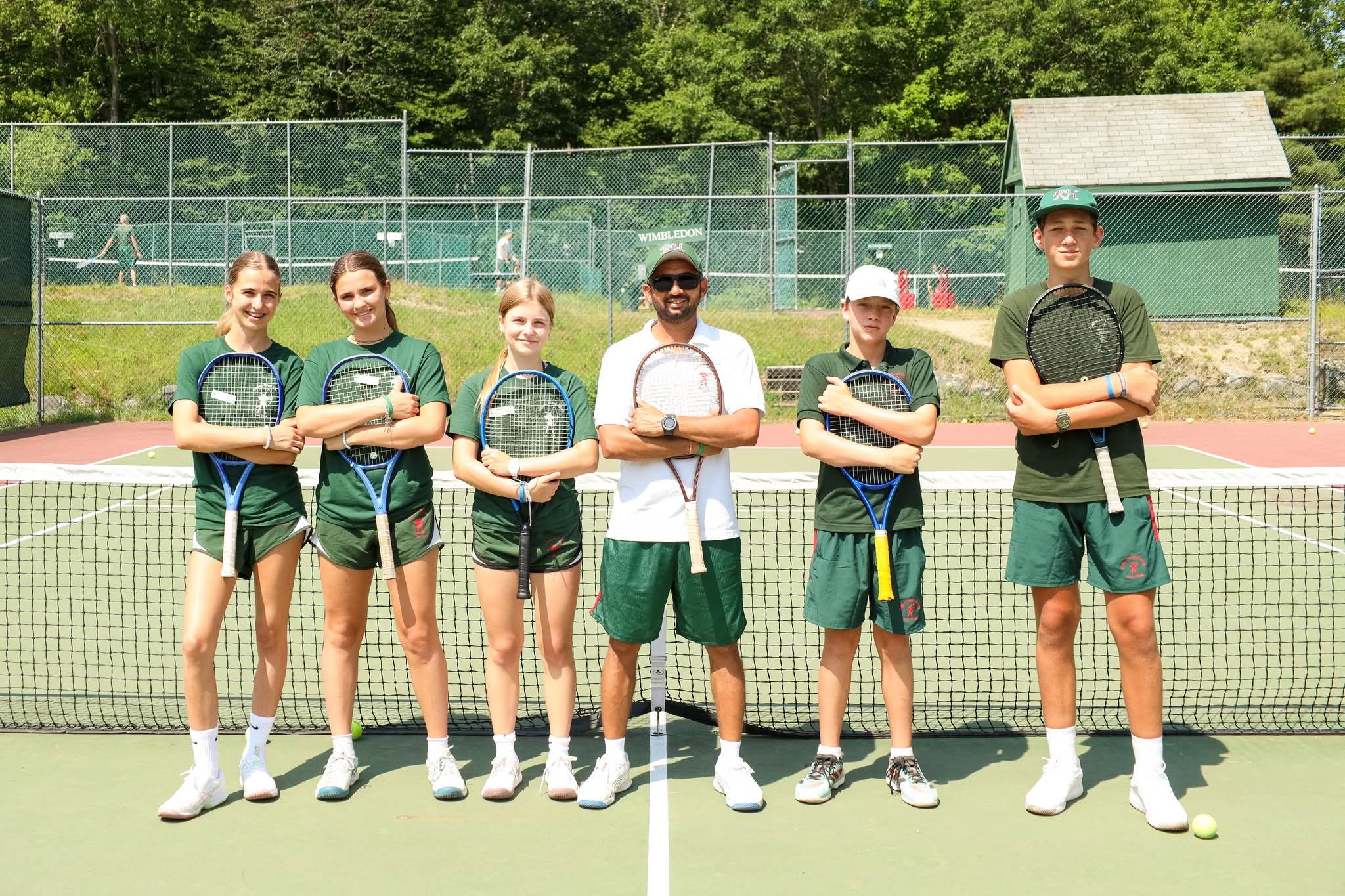Tennis Academy players lined up at the net