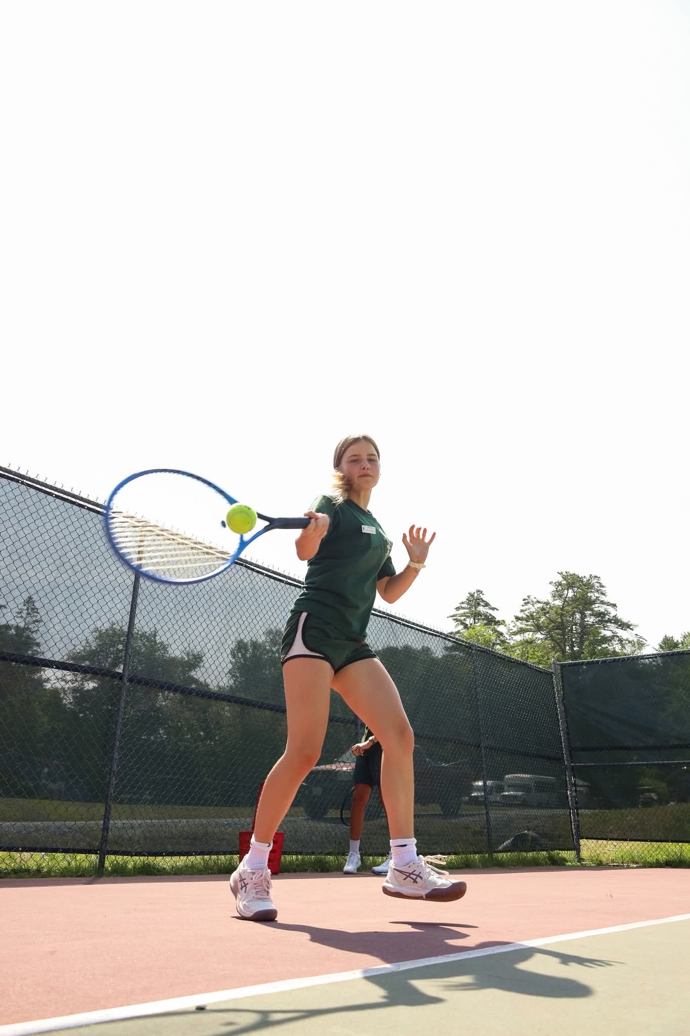 Camper hitting a forehand at Robin Hood Summer Camp
